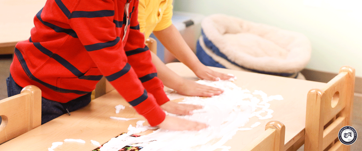 Image of students hands on paper
