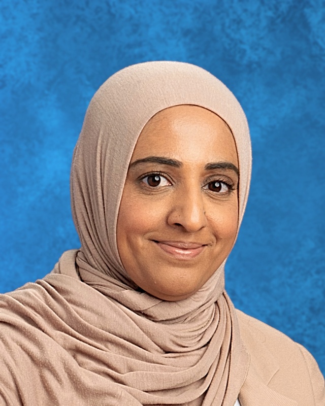 Photo of smiling woman with beige hijaab