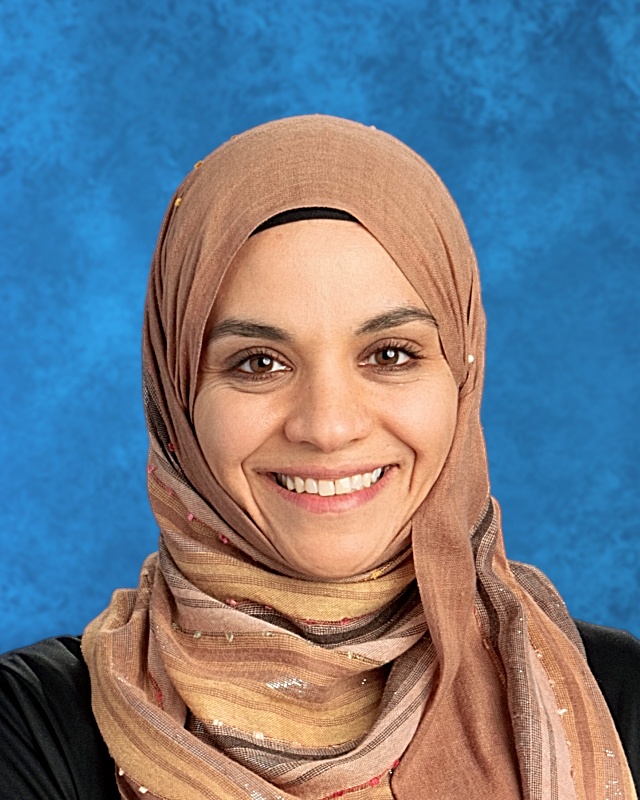 Photo of smiling woman with beige hijaab