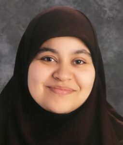 Photo of light complexioned smiling woman wearing dark hijab